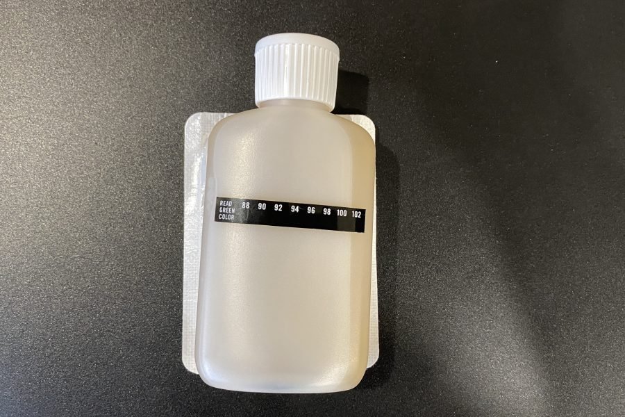 heating pad applied to synthetic urine bottle