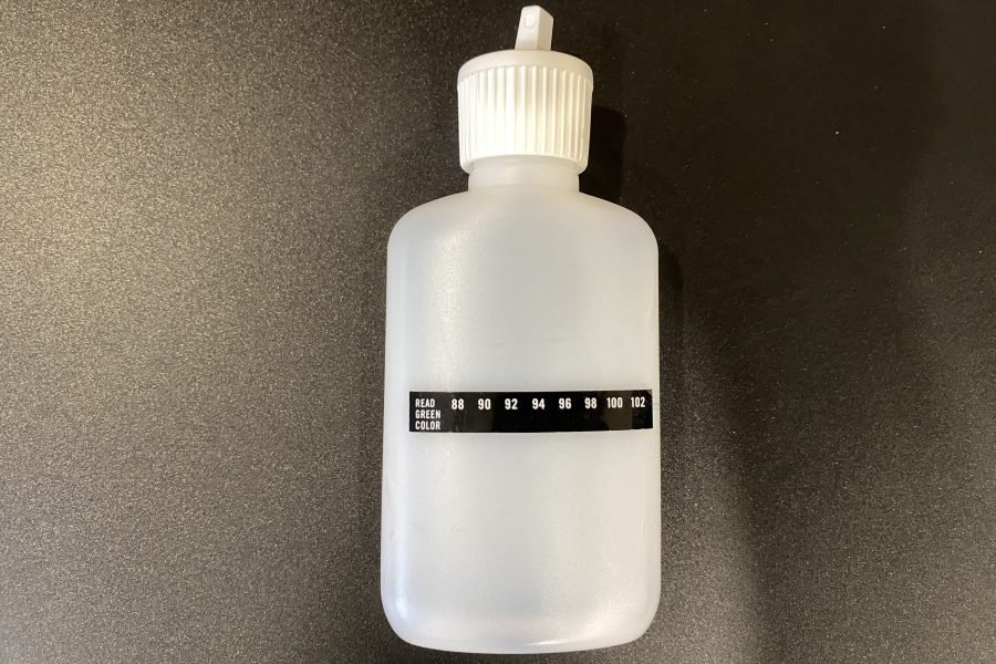 urine bottle empty with temperature strip